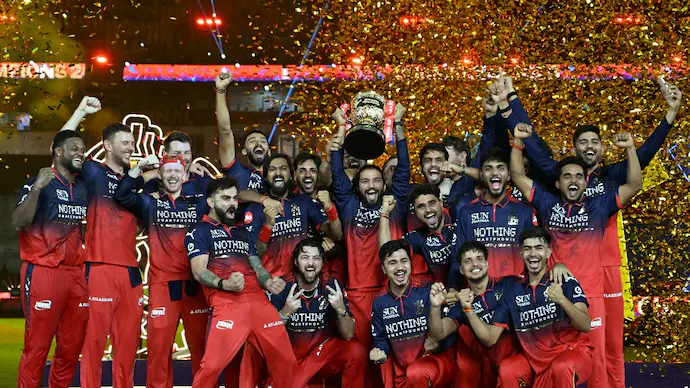 RCB IPL 2026 Champions - Virat Kohli lifting trophy